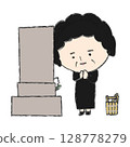 An old woman praying in front of a grave 128778279