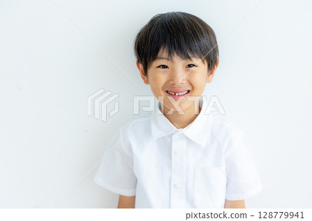 Portrait of an elementary school student on a white background Portrait of an elementary school student on a white background 128779941