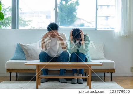 Depressed couple Depressed couple 128779990