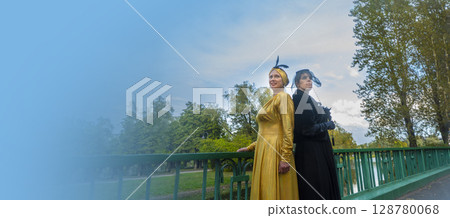 girl in a black dress in the birch branches in autumn girl in a black dress in the birch branches in autumn 128780068