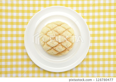 Melon bread on a white plate 128780477