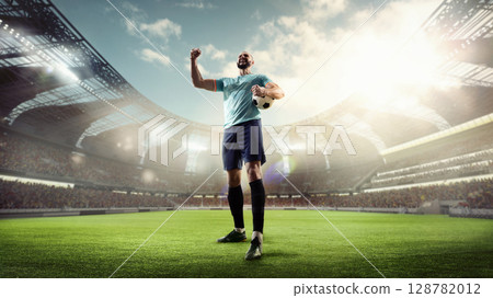 Bearded footballer shouting emotionally with ball on field in 3D stadium 128782012