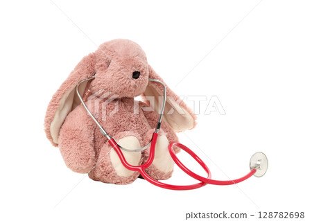Stuffed bunny with stethoscope for fun, isolated on white, PNG 128782698