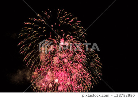 Fireworks in the Summer Night Sky 128782980