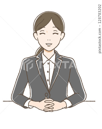 A woman in a suit smiling facing forward 128783202