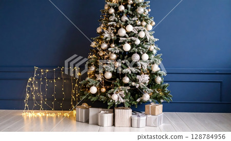 A beautifully decorated Christmas tree, adorned with festive ornaments and a shining star, stands tall with an array of colorful presents beneath its boughs, celebrating the holiday season A beautifully decorated Christmas tree, adorned with festive ornaments and a shining star, stands tall with an array of colorful presents beneath its boughs, celebrating the holiday season 128784956