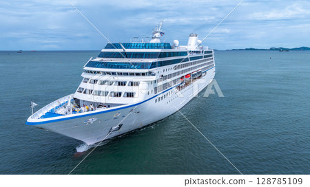 Aerial view cruise ship liner on ocean sea, Luxury cruise ship liner modern maritime travel lifestyle ocean sea, Cruise ship liner exclusive tourism travel on holiday take vacation time. 128785109