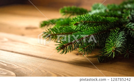 Christmas tree decoration on rustic wooden background, a festive evergreen branch for winter holiday celebration 128785242