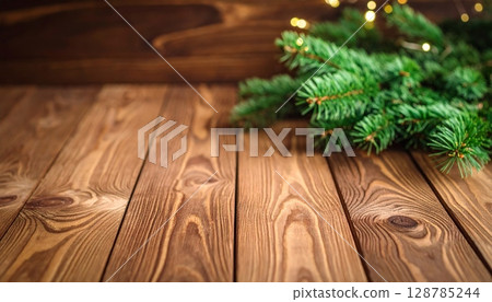 Christmas tree decoration on rustic wooden background, a festive evergreen branch for winter holiday celebration Christmas tree decoration on rustic wooden background, a festive evergreen branch for winter holiday celebration 128785244