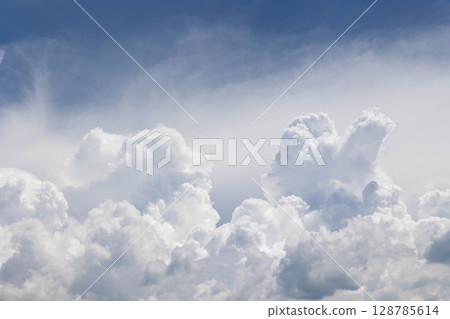 Cumulonimbus clouds rising in the blue sky Cumulonimbus clouds rising in the blue sky 128785614
