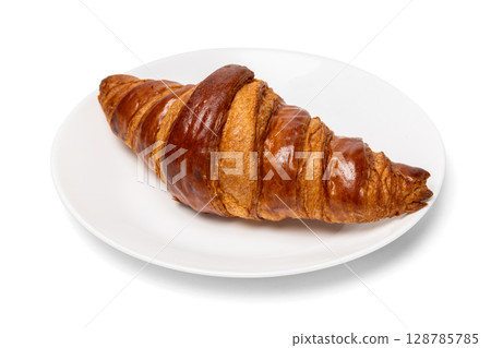 Freshly baked classic delicious fresh organic croissant on white ceramic plate isolated on white background 128785785