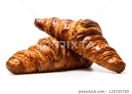 two freshly baked classic delicious fresh organic croissants isolated on white background two freshly baked classic delicious fresh organic croissants isolated on white background 128785789