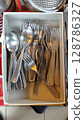 Silverware collection nestled in a box showcasing the beauty of everyday dining tools during a sunlit afternoon 128786327