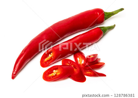 Sliced pods of red natural organic chili pepper on white background 128786381