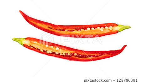 Sliced pods of red natural organic chili pepper on white background 128786391