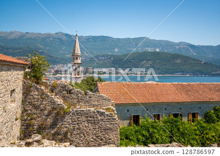Panoramic view from the rooftop of the Citadel in Budva, Montenegro, overlooking the Old Town with its traditional rooftops and historic buildings 128786597
