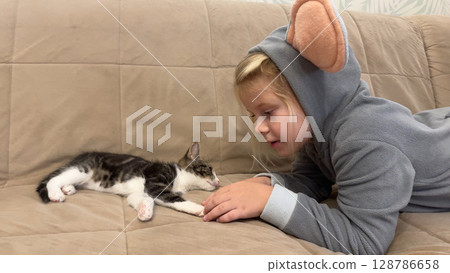 Girl playing with her cat 128786658