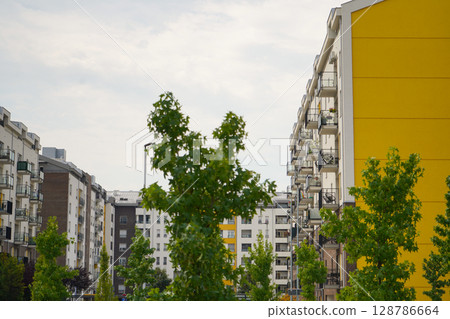 New modern block of flats in green area. residential apartment with flat buildings exterior. luxury house complex. Part of City Real estate property, condo architecture. apartment insurance concept. New modern block of flats in green area. residential apartment with flat buildings exterior. luxury house complex. Part of City Real estate property, condo architecture. apartment insurance concept. 128786664
