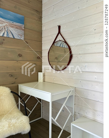 Modern interior of the house white table and wall mirror. High quality photo Modern interior of the house white table and wall mirror. High quality photo 128787249