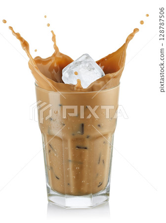 Ice cube falling into coffee with milk forming splash isolated on white background 128787506