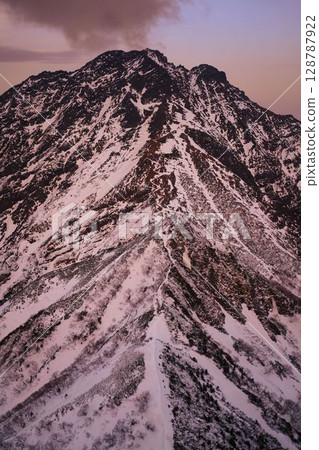 Climbing trail at sunset 128787922