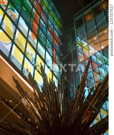 Neon reflected in glass 128787927