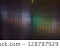 Neon light reflecting off metal 128787929