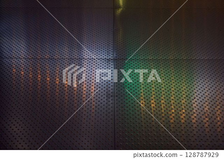 Neon light reflecting off metal 128787929