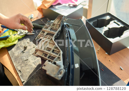 A Detailed Close Up View of an Automotive Headlight Assembly Displaying Quality and Craftsmanship 128788120