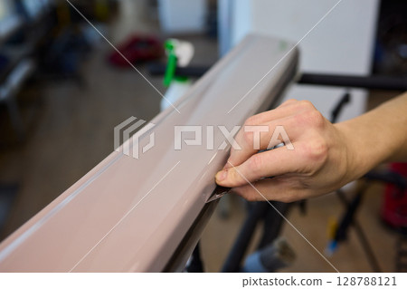 Applying a Protective Film on the Surface of Your Car for Enhanced Durability and Shine 128788121