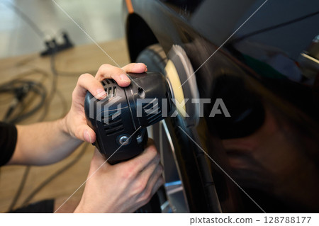 A Detailed Close Up of the Car Polishing Process in the Field of Automotive Detailing A Detailed Close Up of the Car Polishing Process in the Field of Automotive Detailing 128788177