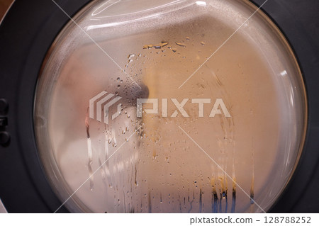 Steam Cleaning keeps Washing Machines efficient and hygienic for optimal performance 128788252