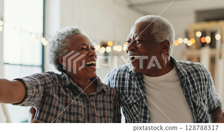 Joyful seniors embrace laughter, capturing a timeless moment of happiness and connection 128788317
