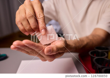 Hands Skillfully Managing Hydroponic Growing Medium with Exact Precise Careful Techniques Hands Skillfully Managing Hydroponic Growing Medium with Exact Precise Careful Techniques 128788850
