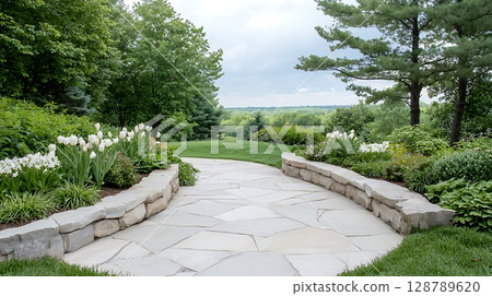 Scenic Stone Pathway Surrounded by Lush Greenery and Vibrant Flowers in a Tranquil Garden 128789620