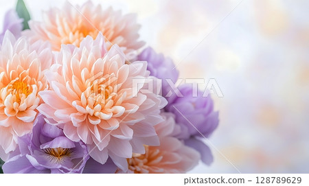 Beautiful arrangement of soft peach and lavender flowers on gentle blurred background Beautiful arrangement of soft peach and lavender flowers on gentle blurred background 128789629