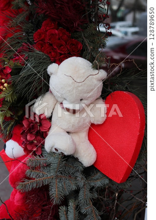 A teddy bear and a red heart. A teddy bear and a red heart. 128789650