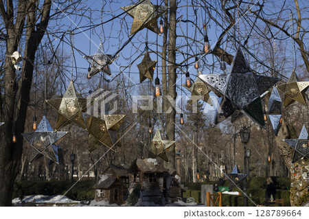An installation of wooden houses. 128789664