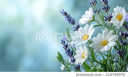 Beautiful arrangement of white daisies and lavender flowers on blurred background 128789970