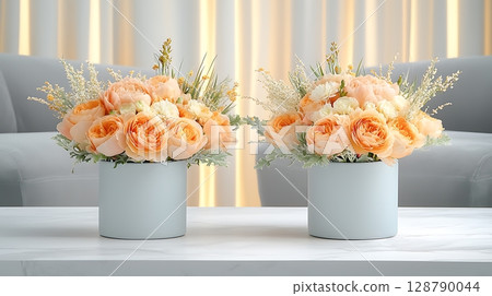 Elegant Floral Arrangements with Soft Orange Roses and Decorative Greenery on a Table 128790044