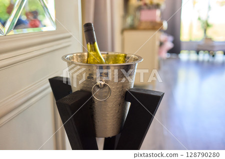 An Elegant Wine Bottle Nestled in an Ice Bucket to Enhance Your Fine Dining Experience 128790280