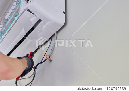 Installing a Wall Mounted Air Conditioning Unit in your home for better cooling comfort Installing a Wall Mounted Air Conditioning Unit in your home for better cooling comfort 128790289