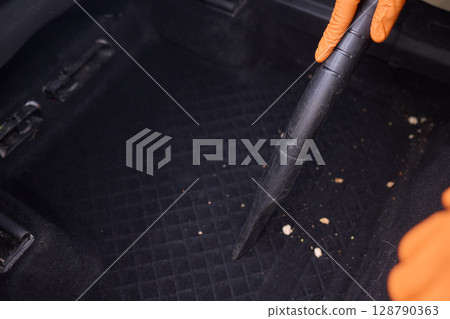 Cleaning the Car Interior with a Vacuum Cleaner for Achieving a Fresh and Clean Look 128790363