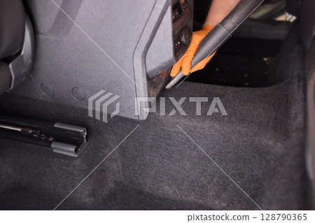 Cleaning the Car Interior with a Vacuum Cleaner for Achieving a Fresh and Clean Look 128790365