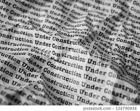 Words Under Construction Seamless print on crumpled paper for business background. Words Under Construction Seamless print on crumpled paper for business background. 128790938