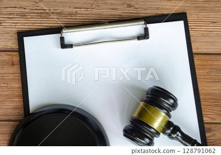 View of blank paper and gavel with customizable space for text. 128791062