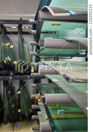 Installing windshield on a car with automotive design 128791315