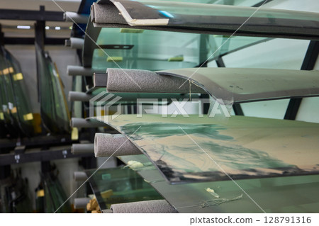 Installing windshield on a car with automotive design 128791316
