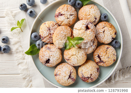 soft blueberry cookies made with fresh blueberries and flavored with lemon extract closeup in the bowl. Horizontal top view soft blueberry cookies made with fresh blueberries and flavored with lemon extract closeup in the bowl. Horizontal top view 128791998