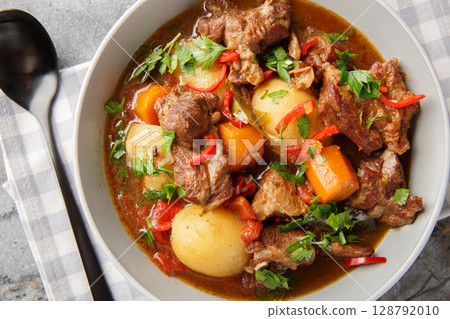 Semur Daging Sapi or Beef Stew, an Indonesian traditional cuisine very popular during Idul Adha closeup in the bowl. Horizontal top view 128792010